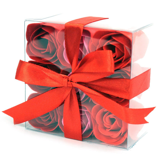 Red soap roses in a clear gift box with a red bow 