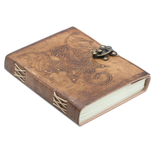 Brown leather notebook with dragon design and latch on a white background