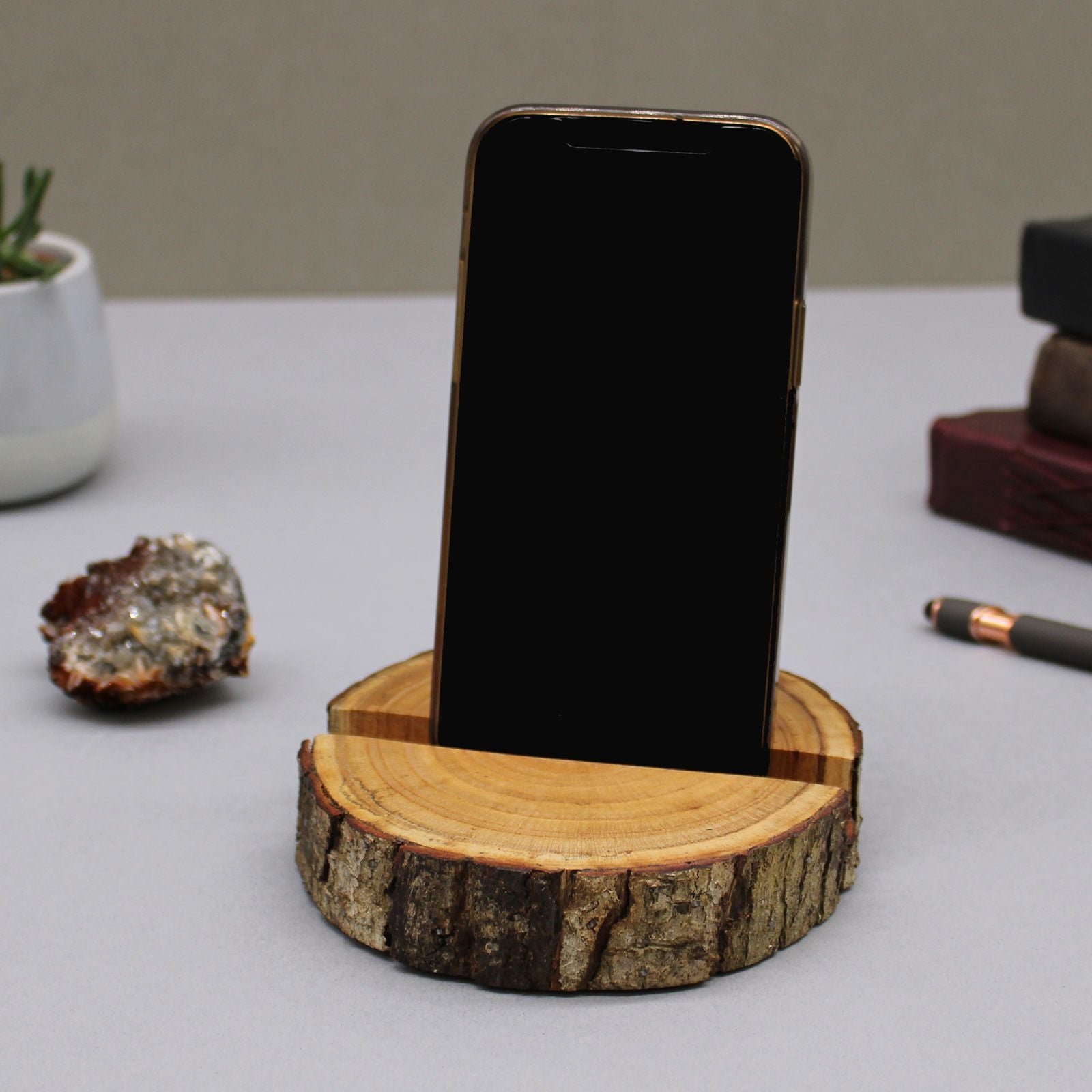 Phone on a wooden stand with a natural wood texture