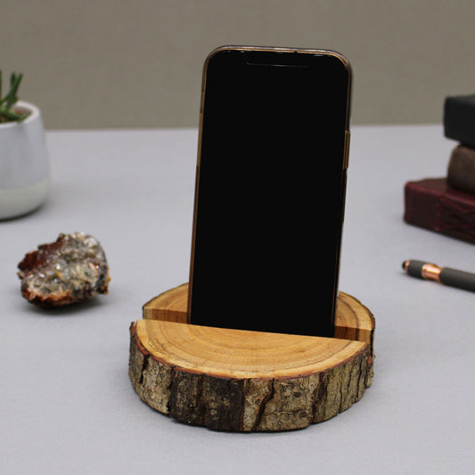 Phone on a wooden stand with a natural wood texture