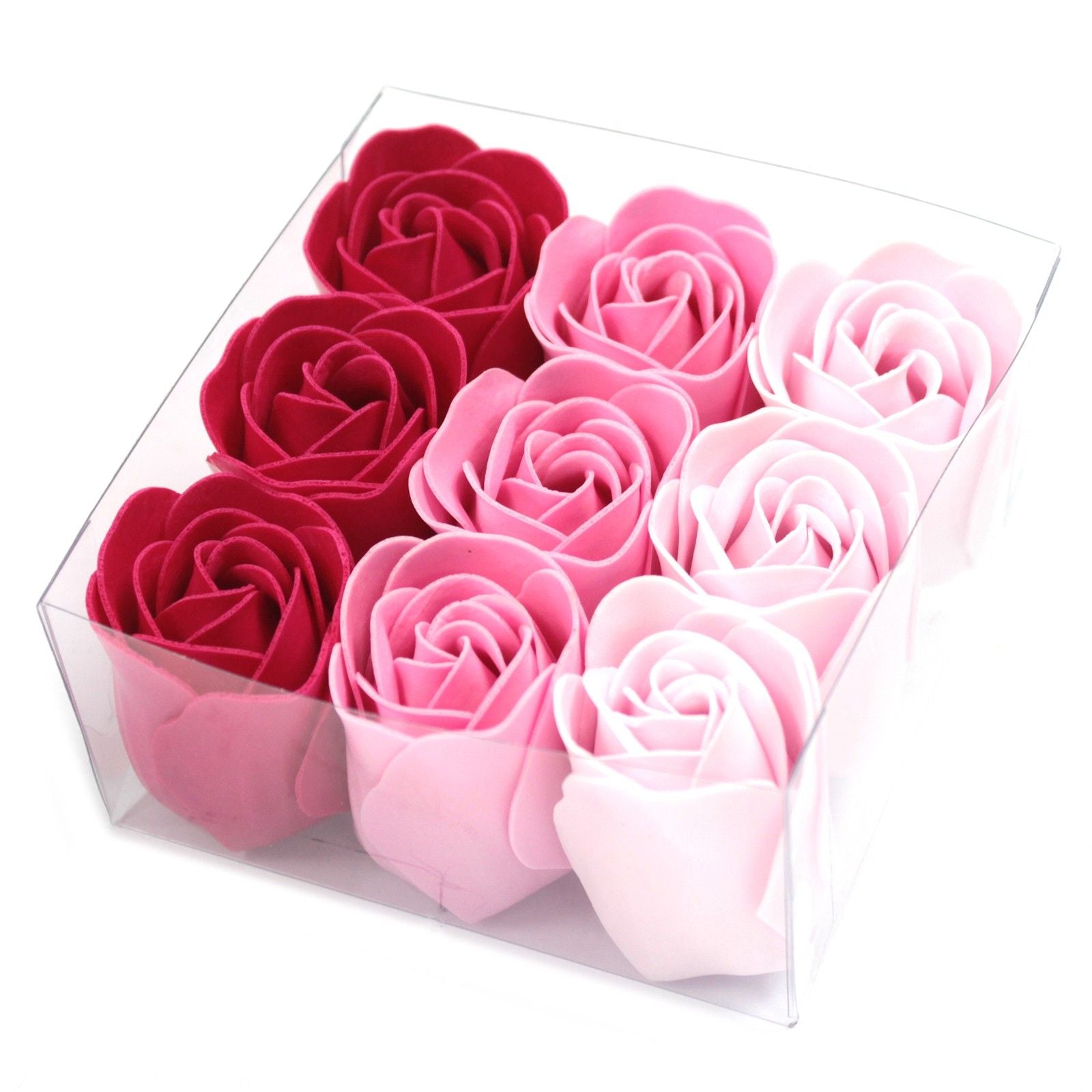 Box of red, pink, and white rose-shaped soaps on a white background