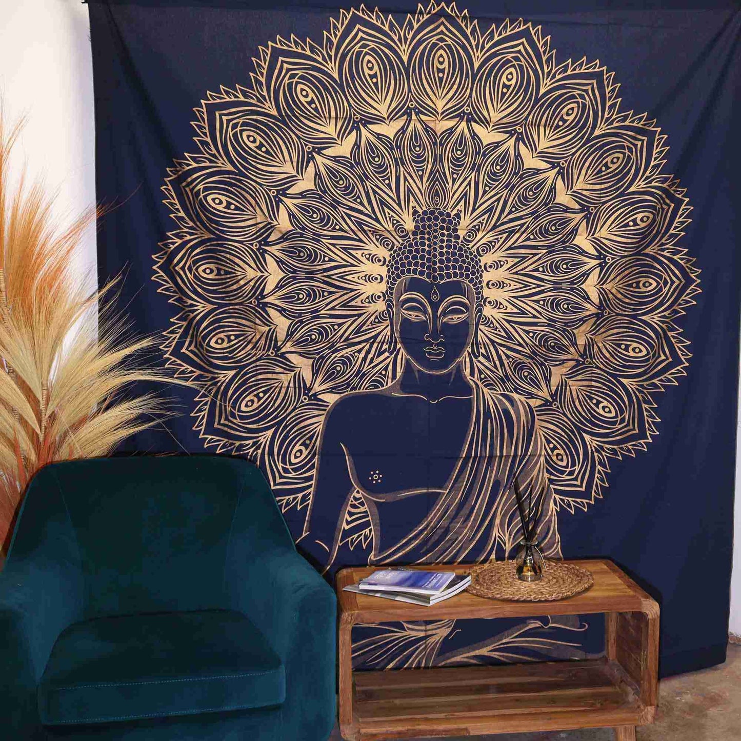 Double Cotton Bedspread / Wall Hanging - Buddha - Blue Gold hanging on a wall above a green armchair and wooden table.