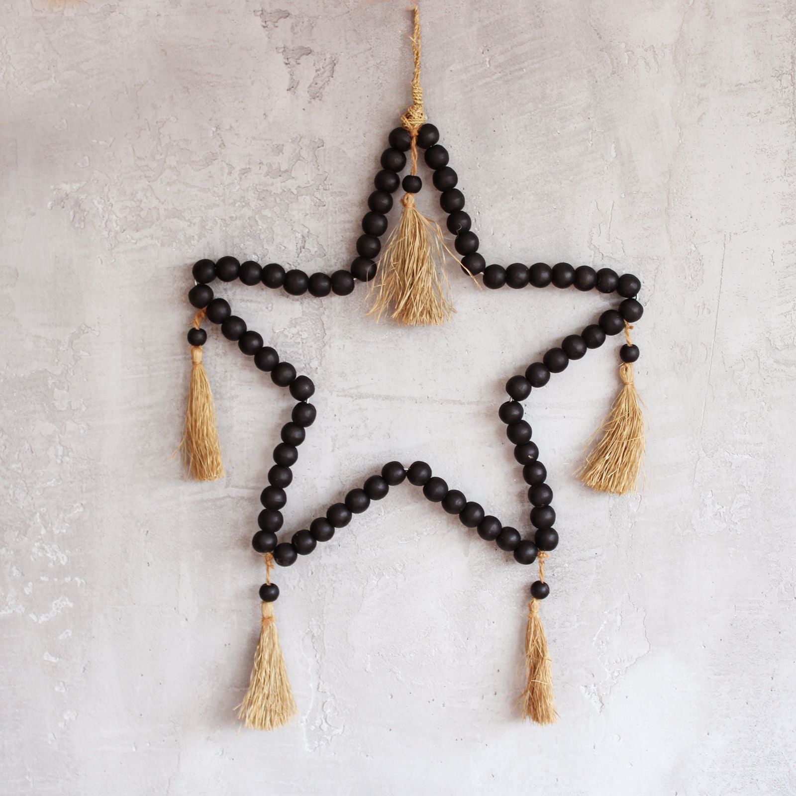 Large Bead Star Mobile against a light coloured wall