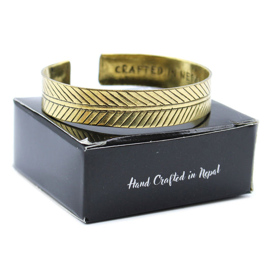 Brass Tibetan Bracelet - Wide Tribal Leaf on a black box with 'Hand Crafted in Nepal' text