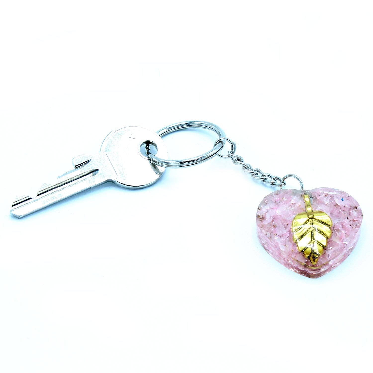 Orgonite Power Keyring - Rose Quartz Heearts Golden Leaf connected to a key on a white background