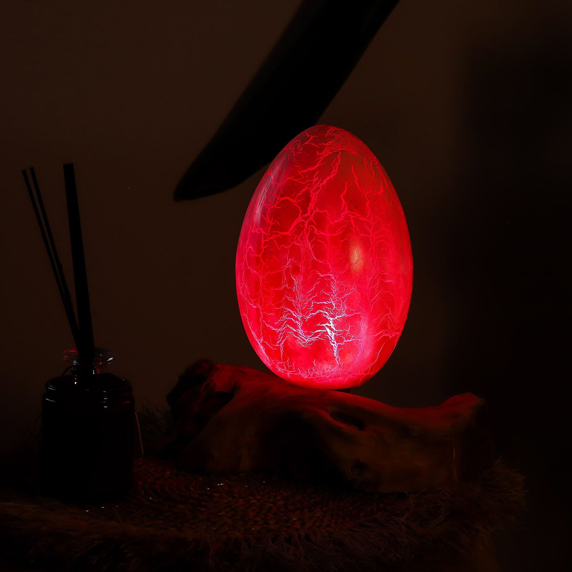 Red glowing egg-like object on a dark background