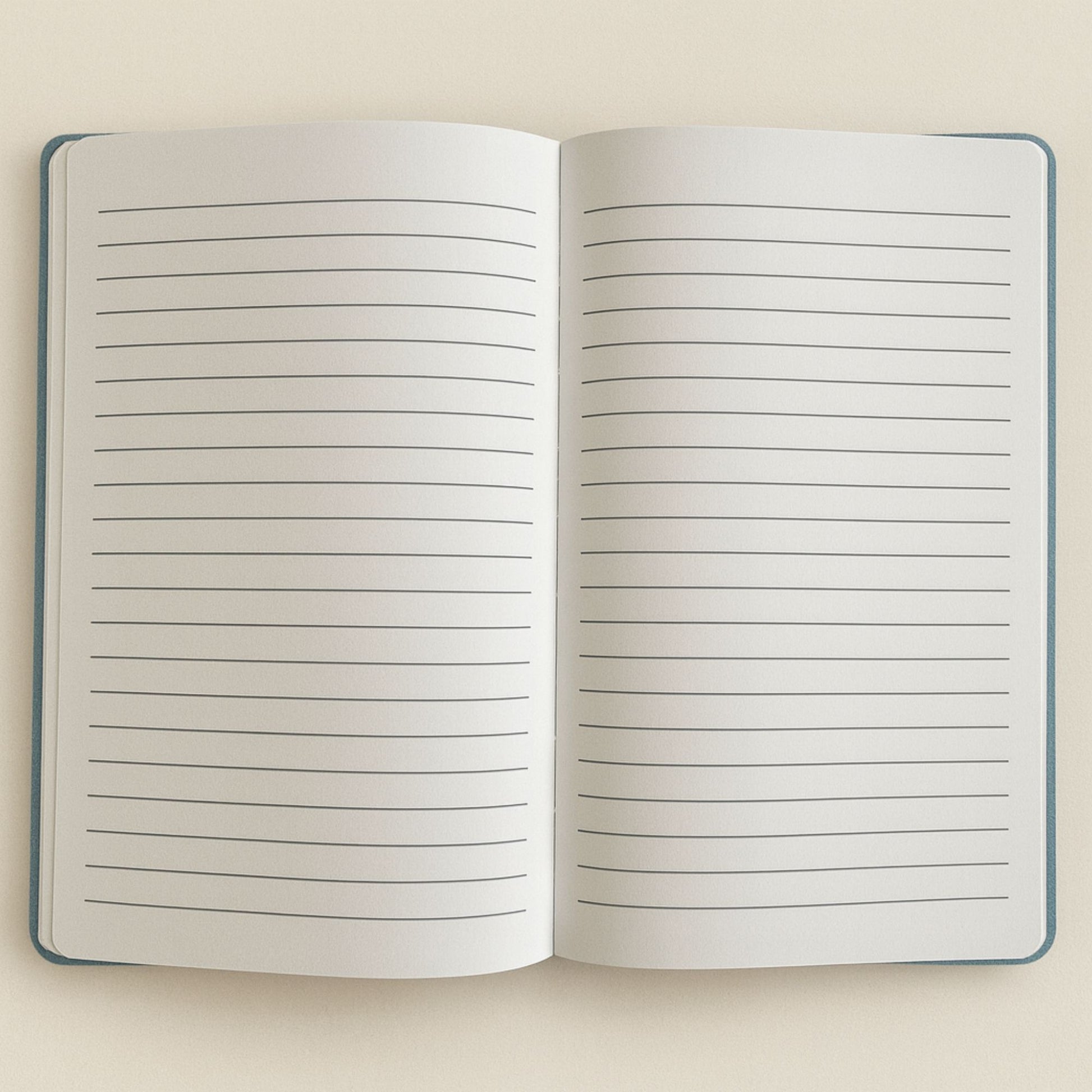 Open notebook with lined pages on a beige background