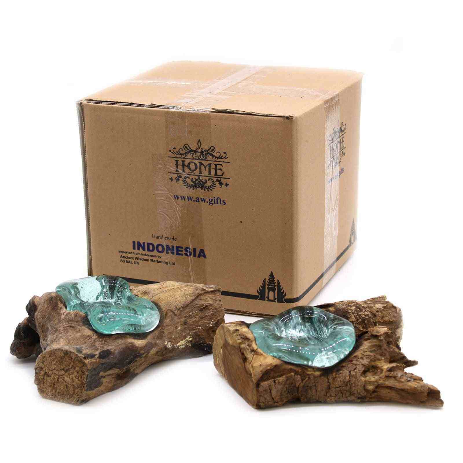 Cardboard box labeled 'HOME' with 'INDONESIA' and decorative items on a white background