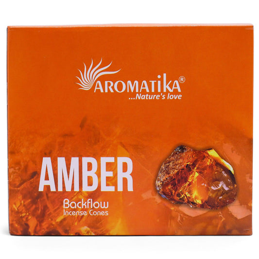Aromatika Amber backflow incense cones packaging on an orange background
