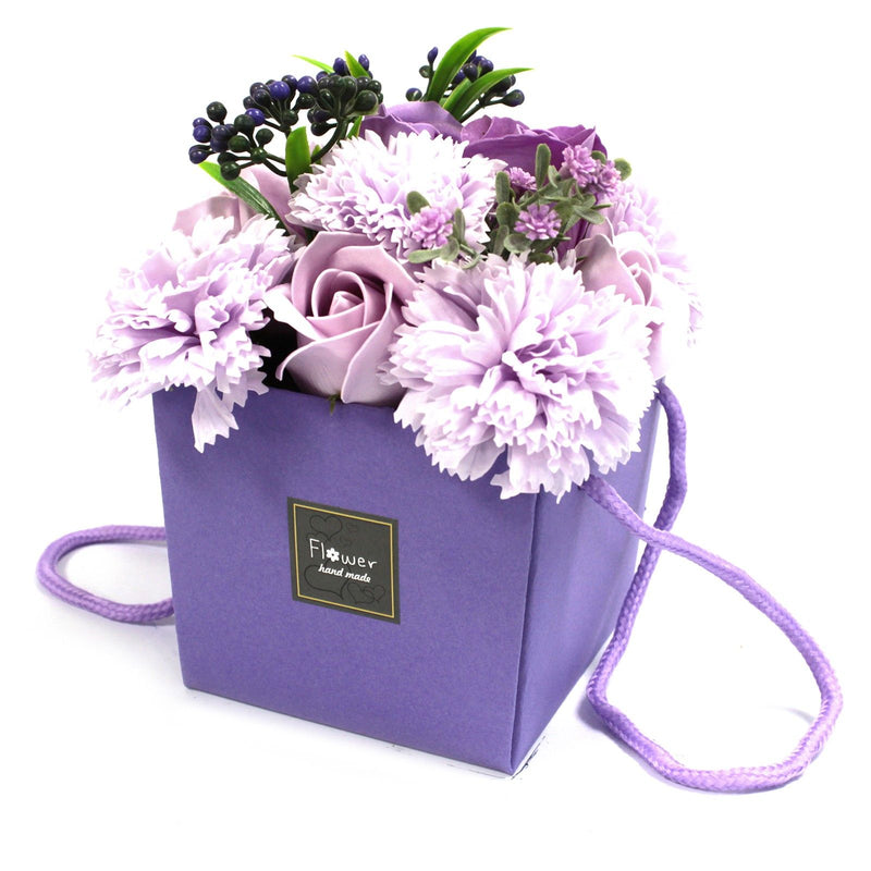 Purple soap flower arrangement in a purple gift box