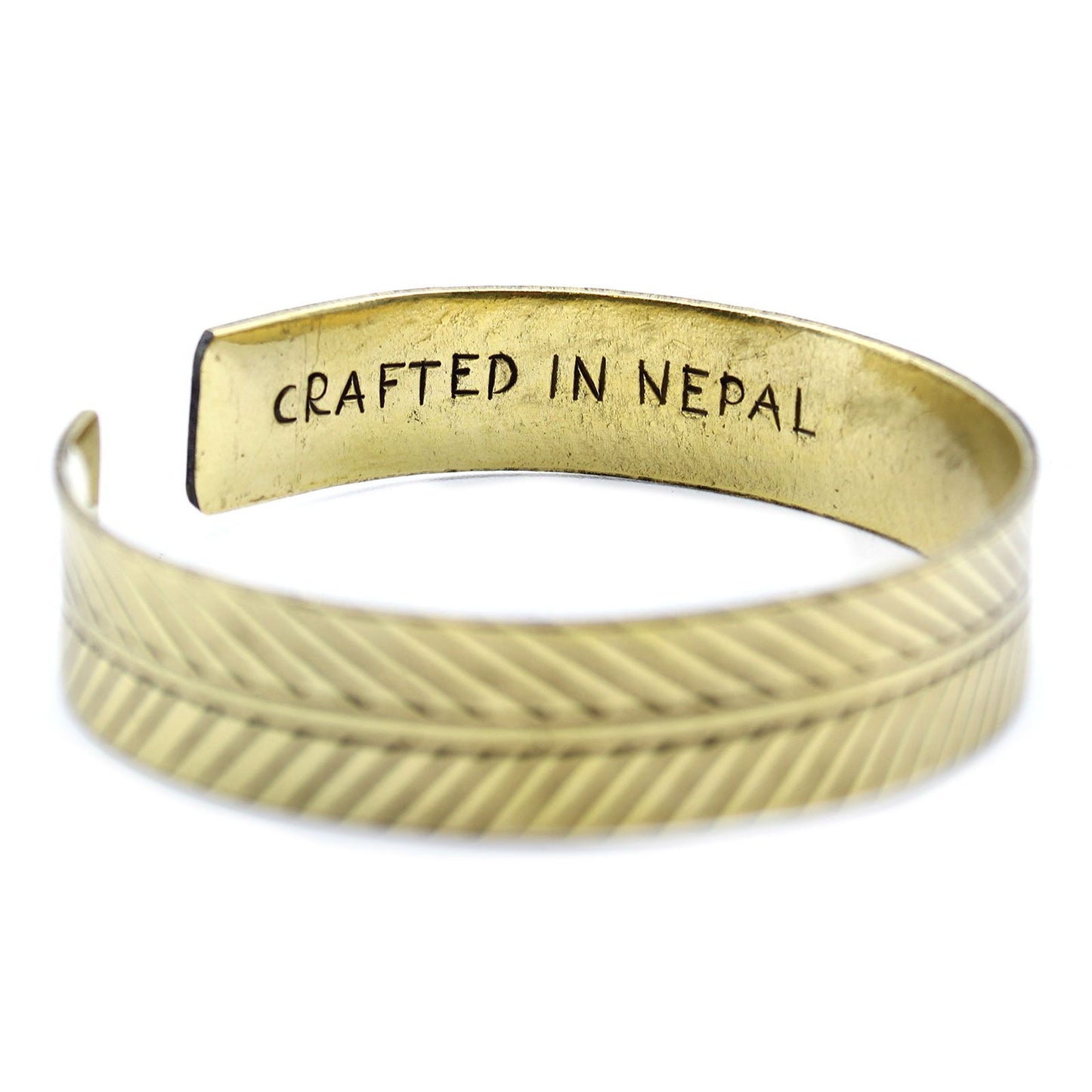 Brass Tibetan Bracelet - Wide Tribal Leaf with 'Crafted in Nepal' engraving on a white background