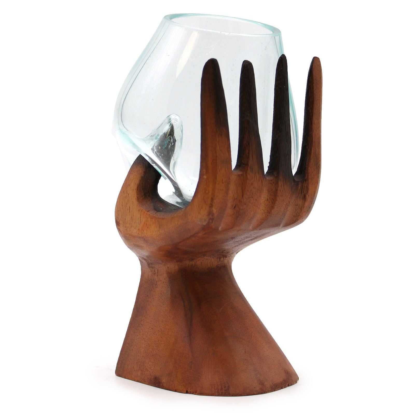 Carved Hand with Molten Glass Bowl on a white background