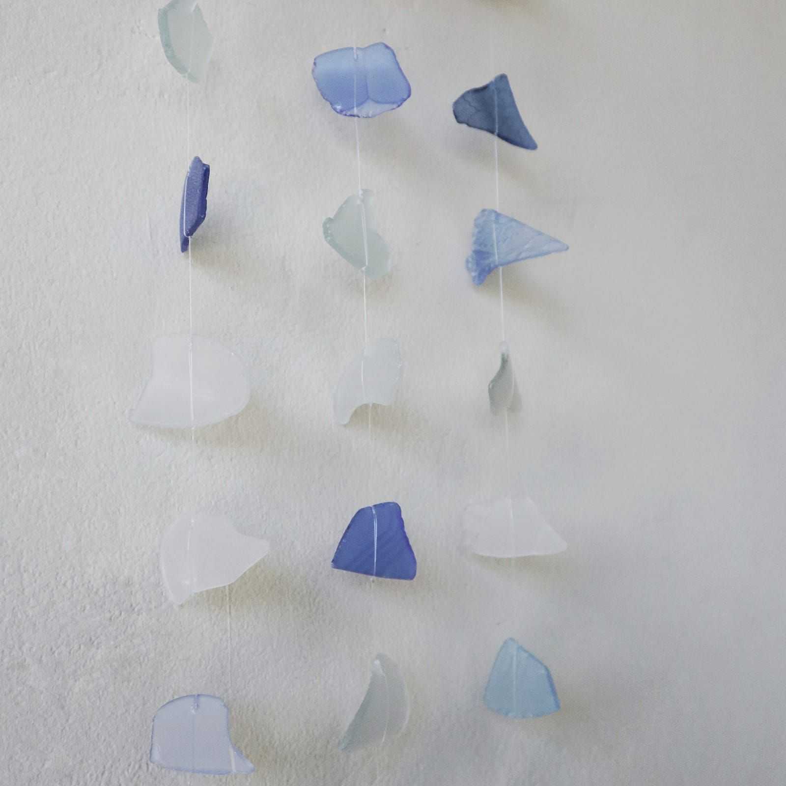 Three Drop Wind Chime Blue & White - Recycled Glass on a textured white background