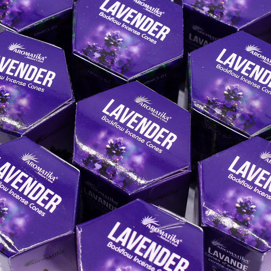 Multiple boxes of Aromatika Lavender Backflow Incense Cones on a reflective surface.