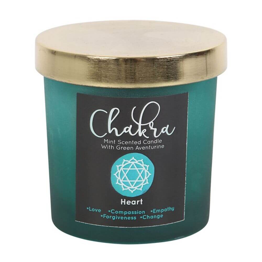 Heart chakra mint scented candle in green frosted glass with gold lid and green aventurine chips, promoting love and compassion.