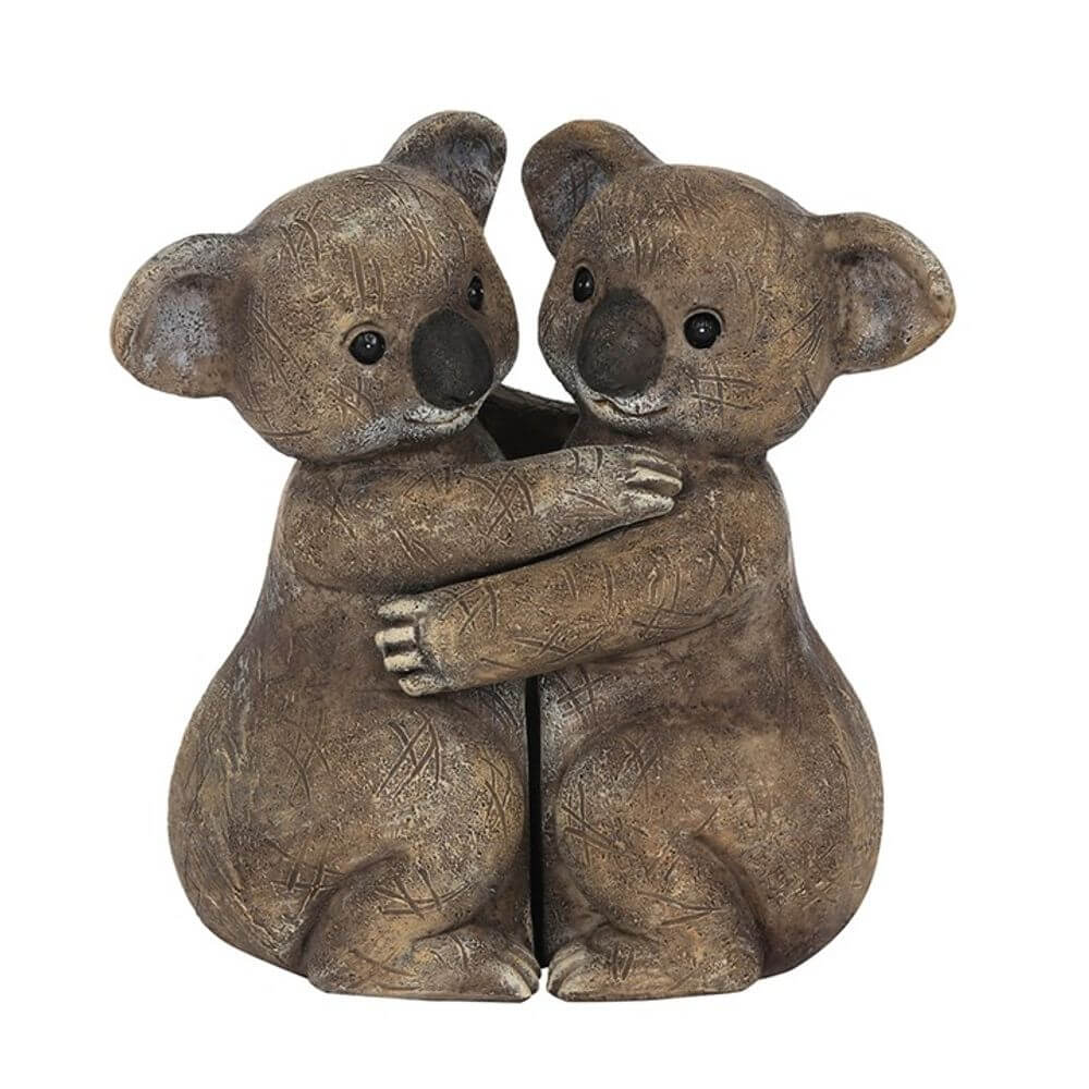 koala bears hugging ornament on white background
