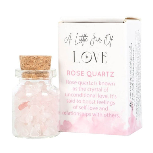 Jar of Love with rose quartz crystal chips in a charming matchbox, promoting unconditional love and healthy relationships.