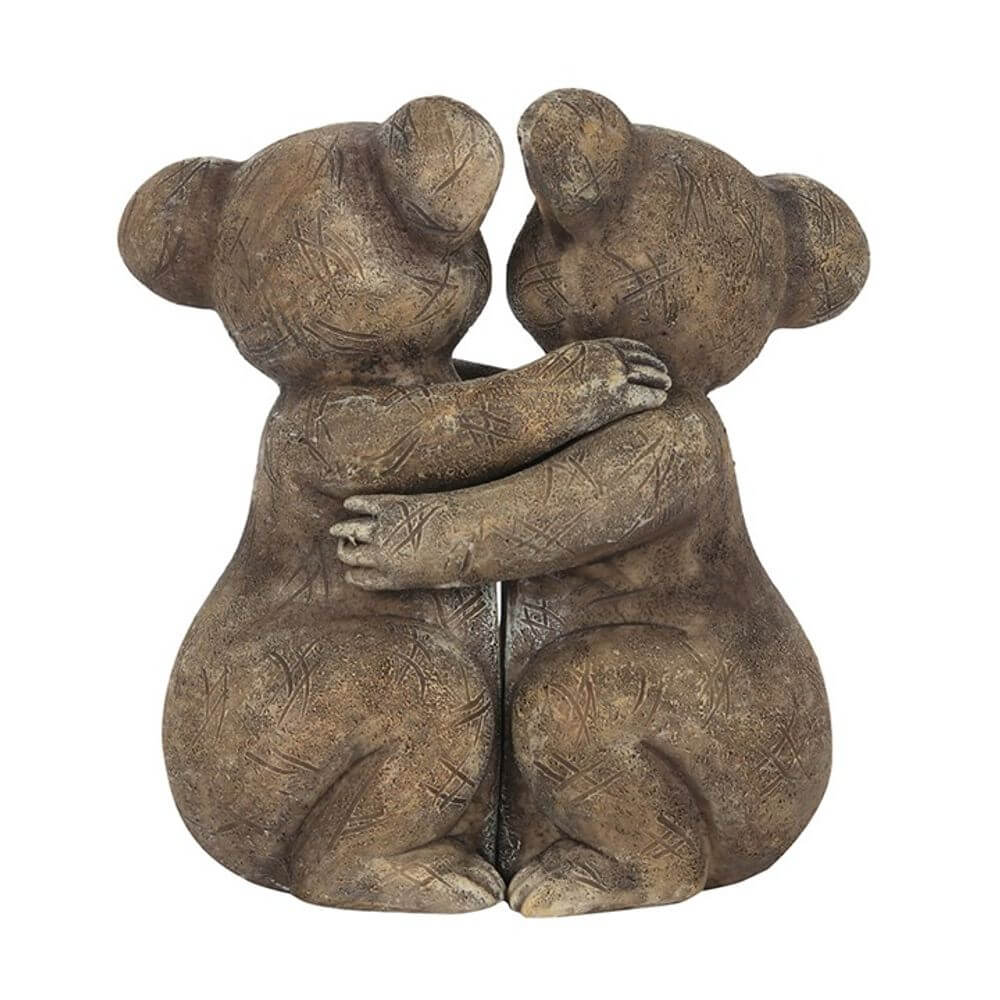 koala bears hugging ornament on white background
